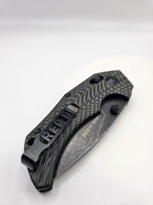 Folding knife with textured handle on a white background
